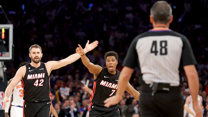 May 2, 2023; New York, New York, USA; Miami Heat forward Kevin Love (42) and guard Kyle Lowry (7) argue with referee Scott Foster (48) during the fourth quarter of game two of the 2023 NBA Eastern Conference semifinals against the New York Knicks at Madison Square Garden. Mandatory Credit: Brad Penner-Imagn Images