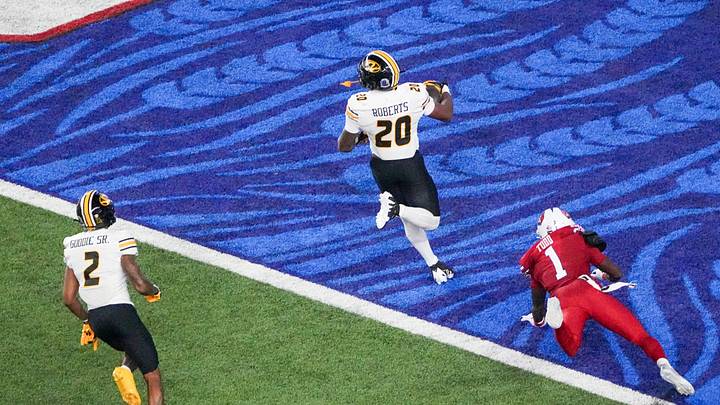 Sep 11, 2026; Lawrence, Kansas, USA; Missouri Tigers running back Jamal Roberts (20) scores as Kansas Jayhawks cornerback Jalen Todd (1) chases during the first half of the game at David Booth Kansas Memorial Stadium. Mandatory Credit: Denny Medley-Imagn Images