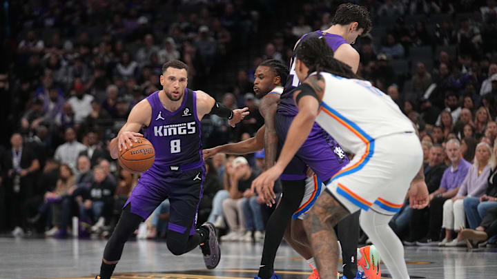 Nov 7, 2025; Sacramento, California, USA; Sacramento Kings guard Zach LaVine (8) dribbles the ball against the Oklahoma City Thunder in the second quarter at the Golden 1 Center. Mandatory Credit: Cary Edmondson-Imagn Images