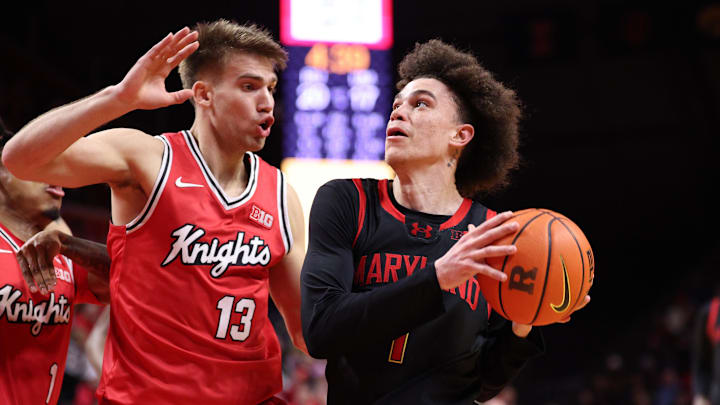 Feb 15, 2026; Piscataway, New Jersey, USA; Maryland Terrapins guard Darius Adams (1) goes to the basket against Rutgers Scarlet Knights guard Harun Zrno (13) during the first half at Jersey Mike's Arena. Mandatory Credit: Vincent Carchietta-Imagn Images Feb 15, 2026; Piscataway, New Jersey, USA; Maryland Terrapins guard Darius Adams (1) goes to the basket against Rutgers Scarlet Knights guard Harun Zrno (13) during the first half at Jersey Mike's Arena. Mandatory Credit: Vincent Carchietta-Imagn Images