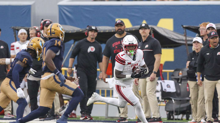 Sep 27, 2025; Morgantown, West Virginia, USA; Utah Utes running back Wayshawn Parker (1) runs the ball during the third quarter against the West Virginia Mountaineers at Milan Puskar Stadium. Mandatory Credit: Ben Queen-Imagn Images