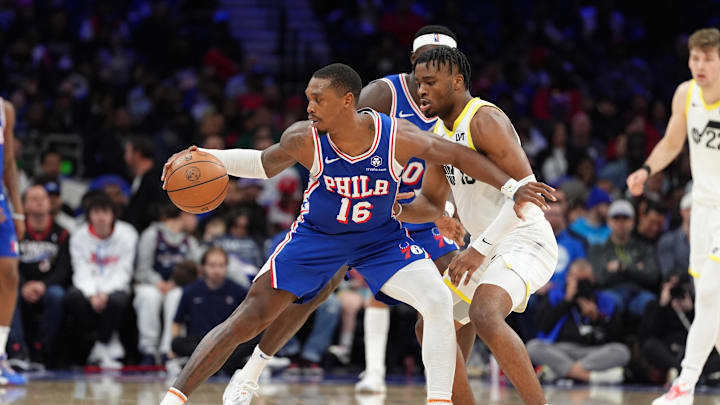 Mar 9, 2025; Philadelphia, Pennsylvania, USA; Philadelphia 76ers guard Lonnie Walker IV (16) shields the ball from Utah Jazz guard Isaiah Collier (13) in the fourth quarter at Wells Fargo Center. Mandatory Credit: Kyle Ross-Imagn Images
