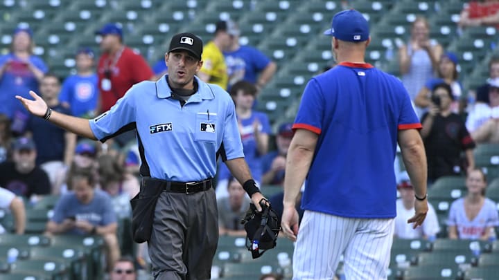 Chicago Cubs manager David Ross (3), talks about a call made by umpire Pat Hoberg (31) in the ninth inning at Wrigley Field.
