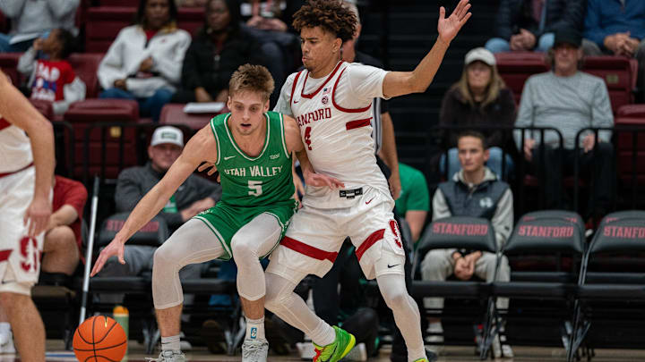 Utah Valley Wolverines guard Tanner Toolson (5) is guarded by Stanford Cardinal guard Oziyah Sellers (4) during the first quarter at Maples Pavilion