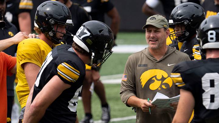 Iowa offensive coordinator Tim Lester huddles with players Aug. 15, 2026 during the Kids Day at Kinnick open practice at Kinnick Stadium in Iowa City, Iowa. Iowa offensive coordinator Tim Lester huddles with players Aug. 15, 2026 during the Kids Day at Kinnick open practice at Kinnick Stadium in Iowa City, Iowa.