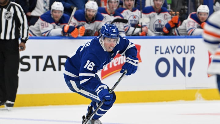 Nov 16, 2024; Toronto, Ontario, CAN; Toronto Maple Leafs forward Mitch Marner (16) skates with the puck against the Edmonton Oilers in the third period at Scotiabank Arena. Mandatory Credit: Dan Hamilton-Imagn Images
