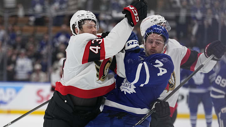 Apr 20, 2025; Toronto, Ontario, CAN; Ottawa Senators defenseman Tyler Kleven (43) hits Toronto Maple Leafs forward Bobby McMann (74) during the third period of game one of the first round of the 2025 Stanley Cup Playoffs at Scotiabank Arena. Mandatory Credit: John E. Sokolowski-Imagn Images