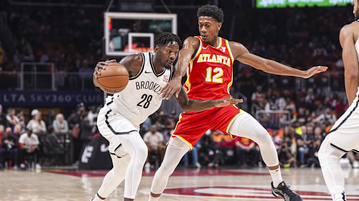 Oct 23, 2024; Atlanta, Georgia, USA; Brooklyn Nets forward Dorian Finney-Smith (28) dribbles against Atlanta Hawks forward De'Andre Hunter (12) during the first half at State Farm Arena. Mandatory Credit: Dale Zanine-Imagn Images Oct 23, 2024; Atlanta, Georgia, USA; Brooklyn Nets forward Dorian Finney-Smith (28) dribbles against Atlanta Hawks forward De'Andre Hunter (12) during the first half at State Farm Arena. Mandatory Credit: Dale Zanine-Imagn Images