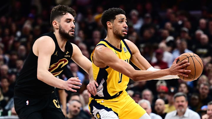 May 13, 2025; Cleveland, Ohio, USA; Indiana Pacers guard Tyrese Haliburton (0) drives to the basket against Cleveland Cavaliers guard Ty Jerome (2) during the second half of game five of the second round for the 2025 NBA Playoffs at Rocket Arena. Mandatory Credit: Ken Blaze-Imagn Images