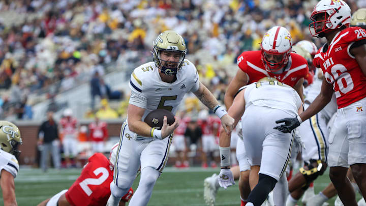 Sep 14, 2024; Atlanta, Georgia, USA; Georgia Tech Yellow Jackets quarterback Zach Pyron (5) runs the ball for a touchdown against the Virginia Military Institute Keydets in the second quarter at Bobby Dodd Stadium at Hyundai Field. Mandatory Credit: Brett Davis-Imagn Images Sep 14, 2024; Atlanta, Georgia, USA; Georgia Tech Yellow Jackets quarterback Zach Pyron (5) runs the ball for a touchdown against the Virginia Military Institute Keydets in the second quarter at Bobby Dodd Stadium at Hyundai Field. Mandatory Credit: Brett Davis-Imagn Images