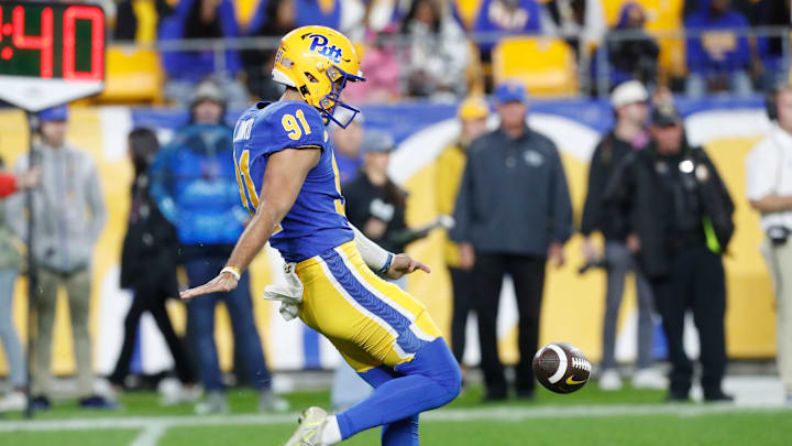 Sep 23, 2023; Pittsburgh, Pennsylvania, USA;  Pittsburgh Panthers punter Caleb Junko (91) punts the ball to the North Carolina Tar Heels during the third quarter at Acrisure Stadium. Mandatory Credit: Charles LeClaire-Imagn Images