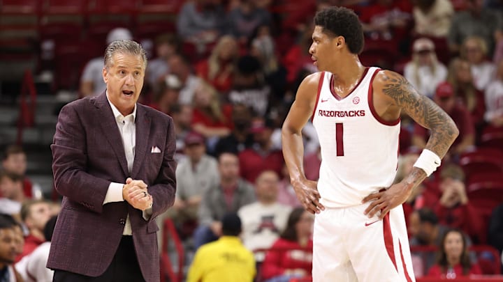 Nov 18, 2025; Fayetteville, Arkansas, USA; Arkansas Razorbacks head coach John Calipari talks to guard Meleek Thomas (1) during the first half against the Winthrop Eagles during the first half at Bud Walton Arena. Mandatory Credit: Nelson Chenault-Imagn Images