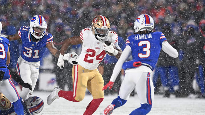 Dec 1, 2024; Orchard Park, New York, USA; San Francisco 49ers running back Jordan Mason (24) prepares for contact by Buffalo Bills safety Damar Hamlin (3) in the first quarter at Highmark Stadium. Mandatory Credit: Mark Konezny-Imagn Images
