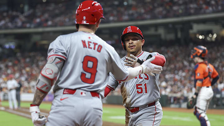 Sep 20, 2024; Houston, Texas, USA; Los Angeles Angels relief pitcher Carson Fulmer (41) celebrates with shortstop Zach Neto (9) after scoring a run during the third inning against the Houston Astros at Minute Maid Park. Mandatory Credit: Troy Taormina-Imagn Images