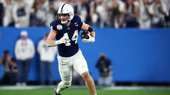 Dec 31, 2024; Glendale, AZ, USA; Penn State Nittany Lions tight end Tyler Warren (44) runs after a catch against the Boise State Broncos during the first half in the Fiesta Bowl at State Farm Stadium. 