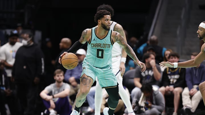 Feb 1, 2025; Charlotte, North Carolina, USA; Charlotte Hornets forward Miles Bridges (0) dribbles the ball during the second quarter against the Denver Nuggets at Spectrum Center. Mandatory Credit: Brian Westerholt-Imagn Images