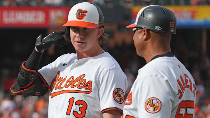 Mar 31, 2025; Baltimore, Maryland, USA; Baltimore Orioles designated hitter Heston Kjerstad (13) gestures to his teammates after driving in a run against the Boston Red Sox at Oriole Park at Camden Yards
