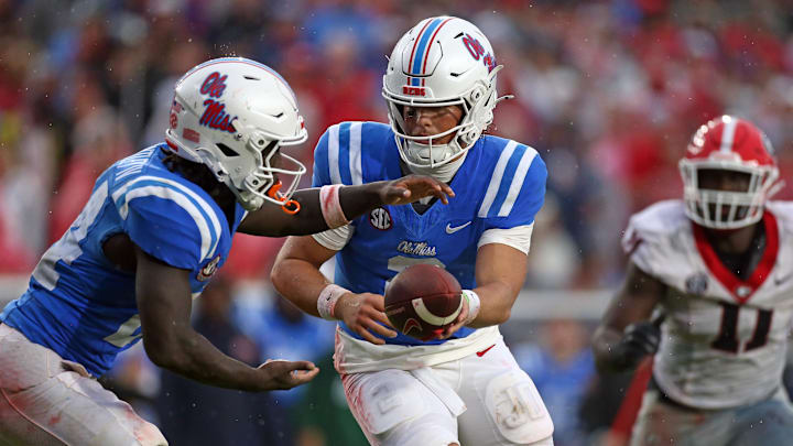 Nov 9, 2024; Oxford, Mississippi, USA; Mississippi Rebels quarterback Jaxson Dart (2) hands the ball off to running back Ulysses Bentley IV (24) during the first half against the Georgia Bulldogs at Vaught-Hemingway Stadium. Mandatory Credit: Petre Thomas-Imagn Images Nov 9, 2024; Oxford, Mississippi, USA; Mississippi Rebels quarterback Jaxson Dart (2) hands the ball off to running back Ulysses Bentley IV (24) during the first half against the Georgia Bulldogs at Vaught-Hemingway Stadium. Mandatory Credit: Petre Thomas-Imagn Images