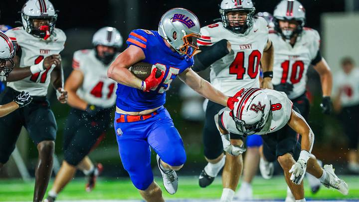 Bolles Bulldogs running back Xander Edwards (25) sheds off Bishop Kenny Crusaders Marco Pulido (8) while running through a hole in the first quarter. The Bolles Bulldogs hosted the Bishop Kenny Crusaders Friday September 11, 2026 at Bolles School in Jacksonville, Fla. Bolles lead 21-6 at the half. [Doug Engle/Florida Times-Union]