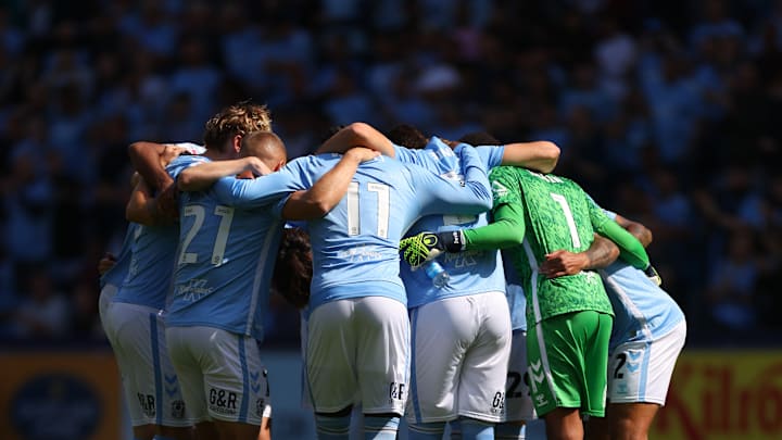 Coventry City FC players in a huddle before their game against Norwich City