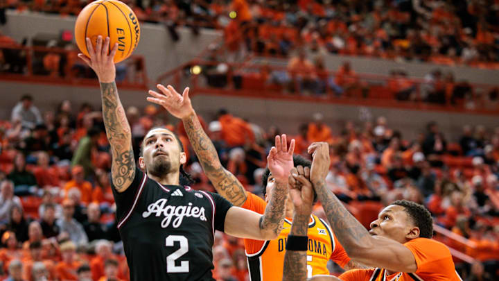 Nov 9, 2025; Stillwater, Oklahoma, USA; Texas A&M Aggies guard Pop Isaacs (2) shoots the ball during the second half against the Oklahoma State Cowboys at Gallagher-Iba Arena. Mandatory Credit: William Purnell-Imagn Images