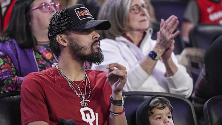 Jan 11, 2025; Athens, Georgia, USA; Atlanta Hawks player Trae Young with his son Tydus watch the game between the Georgia Bulldogs and the Oklahoma Sooners at Stegeman Coliseum. Mandatory Credit: Dale Zanine-Imagn Images Jan 11, 2025; Athens, Georgia, USA; Atlanta Hawks player Trae Young with his son Tydus watch the game between the Georgia Bulldogs and the Oklahoma Sooners at Stegeman Coliseum. Mandatory Credit: Dale Zanine-Imagn Images
