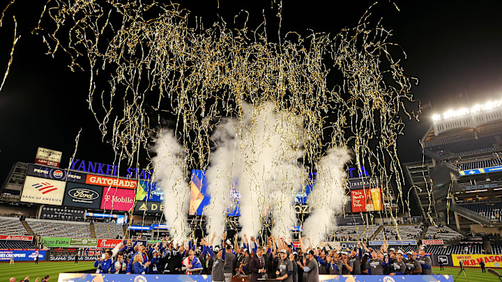 The Los Angeles Dodgers celebrates with the Commissioner’s Trophy after beating the New York Yankees in game five to win the 2024 MLB World Series at Yankee Stadium. The Los Angeles Dodgers celebrates with the Commissioner’s Trophy after beating the New York Yankees in game five to win the 2024 MLB World Series at Yankee Stadium.