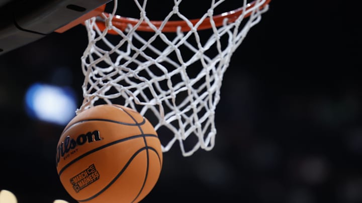 Mar 17, 2023; Columbus, OH, USA;  A basketball displaying the March Madness logo enter the basket before the game between the USC Trojans and the Michigan State Spartans at Nationwide Arena. Mandatory Credit: Rick Osentoski-Imagn Images