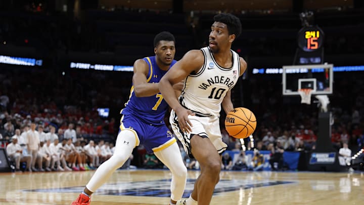 Mar 19, 2026; Oklahoma City, OK, USA; Vanderbilt Commodores forward Ak Okereke (10) drives to the hoop past McNeese Cowboys forward Jerrell Colbert (7) during the first half during a first round game of the men's 2026 NCAA Tournament at Paycom Center. Mandatory Credit: Alonzo Adams-Imagn Images