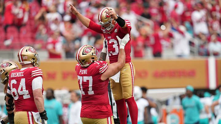 Sep 20, 2026; Santa Clara, California, USA; San Francisco 49ers quarterback Brock Purdy (13) celebratse with offensive line Dominick Puni (77) during the third quarter against the Miami Dolphins at Levi's Stadium. Mandatory Credit: Cary Edmondson-Imagn Images Sep 20, 2026; Santa Clara, California, USA; San Francisco 49ers quarterback Brock Purdy (13) celebratse with offensive line Dominick Puni (77) during the third quarter against the Miami Dolphins at Levi's Stadium. Mandatory Credit: Cary Edmondson-Imagn Images