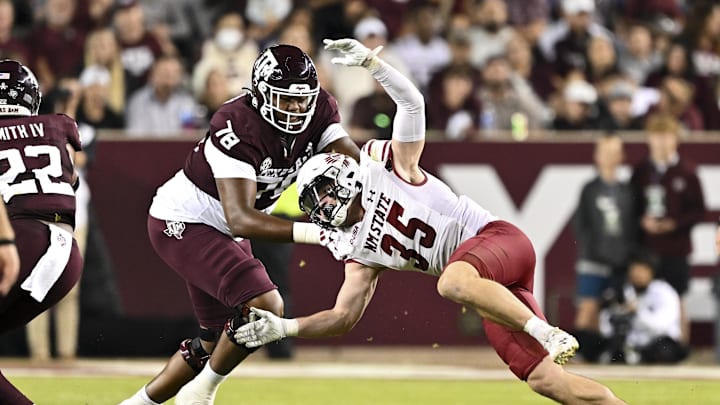 Nov 16, 2024; College Station, Texas, USA; New Mexico State Aggies linebacker Tyler Martinez (35) defends in coverage as Texas A&M Aggies offensive lineman Dametrious Crownover (78) blocks during the second half at Kyle Field. Mandatory Credit: Maria Lysaker-Imagn Images 