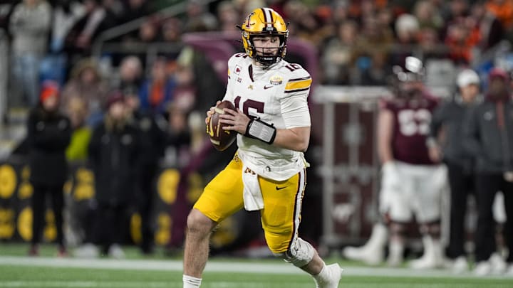 Jan 3, 2025; Charlotte, NC, USA; Minnesota Golden Gophers quarterback Max Brosmer (16) looks to pass against the Virginia Tech Hokies during the second quarter at the Duke’s Mayo Bowl at Bank of America Stadium. Mandatory Credit: Jim Dedmon-Imagn Images