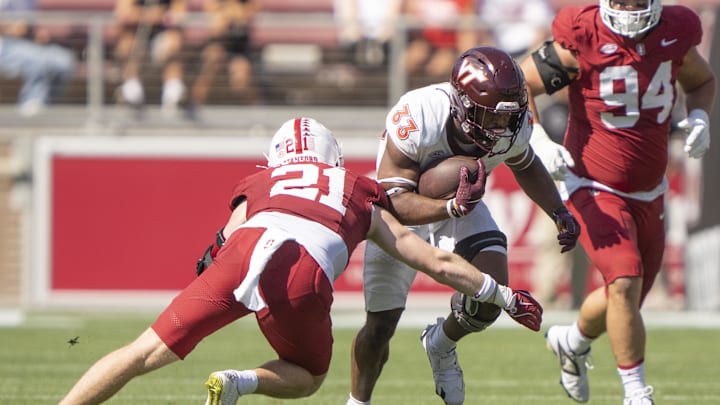 Oct 5, 2024; Stanford, California, USA;  Virginia Tech Hokies running back Bhayshul Tuten (33) runs with the football against Stanford Cardinal safety Scotty Edwards (21) during the second quarter at Stanford Stadium. Mandatory Credit: Stan Szeto-Imagn Images