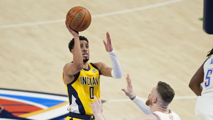 Jun 5, 2025; Oklahoma City, Oklahoma, USA; Indiana Pacers guard Tyrese Haliburton (0) shoots the ball against Oklahoma City Thunder center Isaiah Hartenstein (55) during the third quarter in game one of the 2025 NBA Finals at Paycom Center. Mandatory Credit: Kyle Terada-Imagn Images