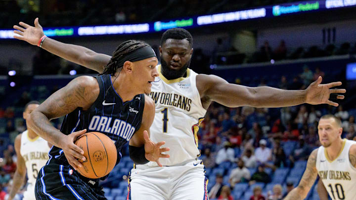 New Orleans Pelicans forward Zion Williamson (1) guards against Orlando Magic forward Paolo Banchero (5) during the first half at Smoothie King Center. Mandatory Credit: Matthew Hinton-Imagn Images New Orleans Pelicans forward Zion Williamson (1) guards against Orlando Magic forward Paolo Banchero (5) during the first half at Smoothie King Center. Mandatory Credit: Matthew Hinton-Imagn Images