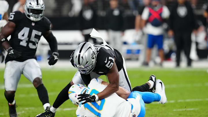 Sep 15, 2025; Paradise, Nevada, USA; Las Vegas Raiders defensive end Malcolm Koonce (51) sacks Los Angeles Chargers quarterback Justin Herbert (10) during the first quarter at Allegiant Stadium. Mandatory Credit: Stephen R. Sylvanie-Imagn Images Sep 15, 2025; Paradise, Nevada, USA; Las Vegas Raiders defensive end Malcolm Koonce (51) sacks Los Angeles Chargers quarterback Justin Herbert (10) during the first quarter at Allegiant Stadium. Mandatory Credit: Stephen R. Sylvanie-Imagn Images