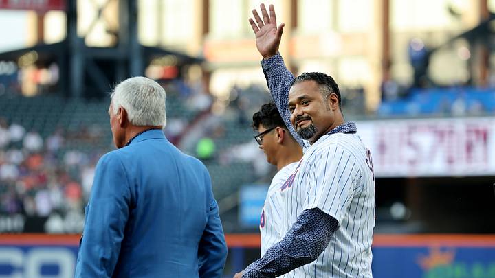 May 31, 2022; New York City, New York, USA;  New York Mets former pitcher Johan Santana waves to the crowd as he walks onto the field for a ceremony celebrating the ten year anniversary of his no-hitter before a game against the Washington Nationals at Citi Field. Mandatory Credit: Brad Penner-Imagn Images