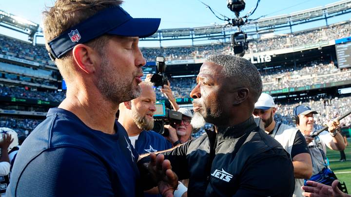 Dallas Cowboys Head Coach, Brian Schottenheimer, and New York Jets Head Coach, Aaron Glenn, greet each other after the game at MetLife Stadium, Sunday, October 5, 2025. Dallas Cowboys Head Coach, Brian Schottenheimer, and New York Jets Head Coach, Aaron Glenn, greet each other after the game at MetLife Stadium, Sunday, October 5, 2025.