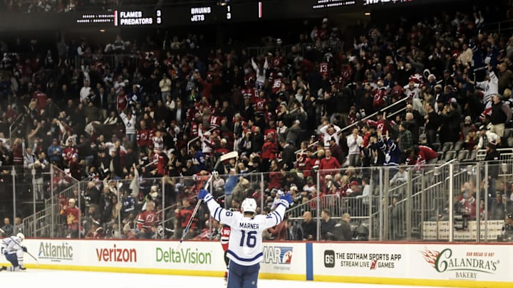 Dec 10, 2024; Newark, New Jersey, USA;   Toronto Maple Leafs right wing Mitch Marner (16) celebrates the winning goal against the New Jersey Devils during overtime at Prudential Center. Mandatory Credit: Luther Schlaifer-Imagn Images