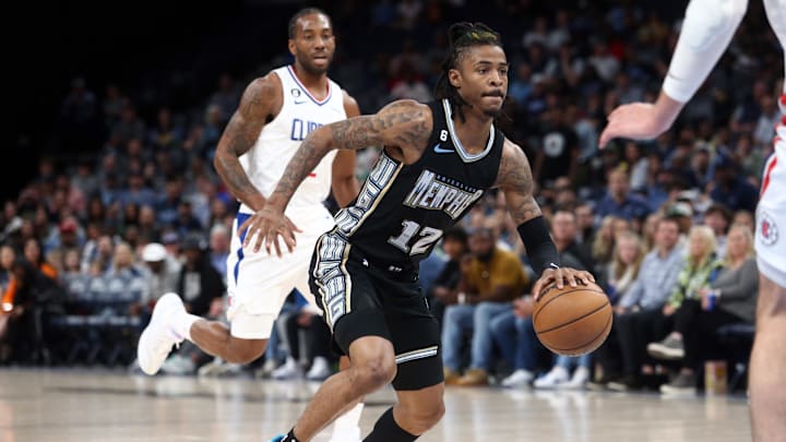 Memphis Grizzlies guard Ja Morant (12) handles the ball as during the first half against the Los Angeles Clippers at FedExForum. Mandatory Credit: Petre Thomas-Imagn Images