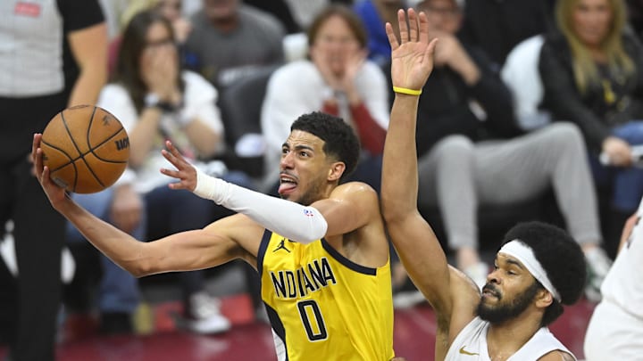 Indiana Pacers guard Tyrese Haliburton (0) drives to the basket beside Cleveland Cavaliers center Jarrett Allen (31) in the fourth quarter during game two of the second round of the 2025 NBA Playoffs.