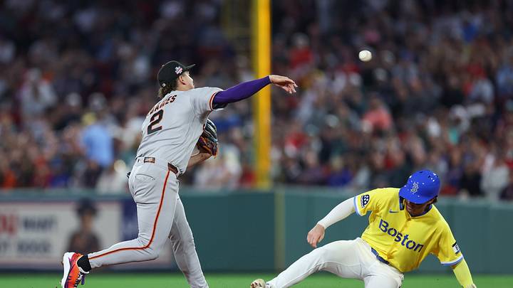 Aug 22, 2026; Boston, Massachusetts, USA; San Francisco Giants shortstop Willy Adames (2) throws over Boston Red Sox second baseman Nick Sogard (20) during the sixth inning at Fenway Park. Mandatory Credit: Paul Rutherford-Imagn Images