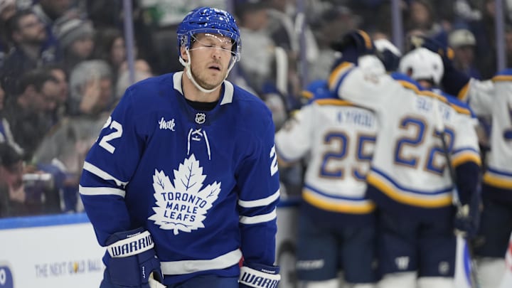 Oct 24, 2024; Toronto, Ontario, CAN; Toronto Maple Leafs defenseman Jake McCabe (22) reacts as the St. Louis Blues celebrate a goal by forward Alexandre Texier (not pictured) during the second period at Scotiabank Arena. Mandatory Credit: John E. Sokolowski-Imagn Images