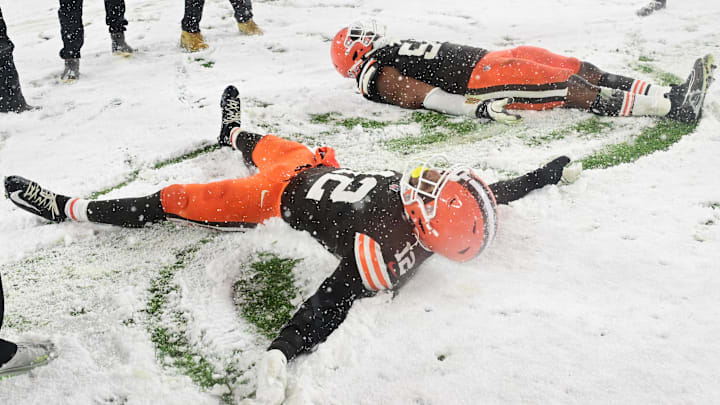 Nov 21, 2024; Cleveland, Ohio, USA; Cleveland Browns safety Rodney McLeod Jr. (12) and defensive end Ogbo Okoronkwo (54) celebrate after the Browns beat the Pittsburgh Steelers at Huntington Bank Field. Mandatory Credit: Ken Blaze-Imagn Images