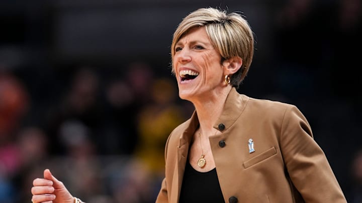 Iowa Hawkeyes head coach Jan Jensen celebrates Saturday, March 7, 2026, during a Big Ten women's basketball tournament semifinals game at Gainbridge Fieldhouse in Indianapolis. The Iowa Hawkeyes defeated the Michigan Wolverines, 59-42.