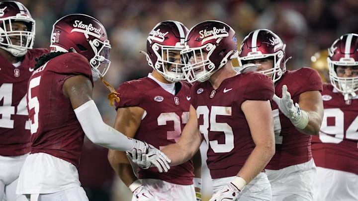 Sep 13, 2025; Stanford, California, USA; Stanford Cardinal linebacker Matt Rose (35) is congratulated by safety Jay Green (5) after a tackle against the Boston College Eagles during the third quarter at Stanford Stadium. Mandatory Credit: Darren Yamashita-Imagn Images