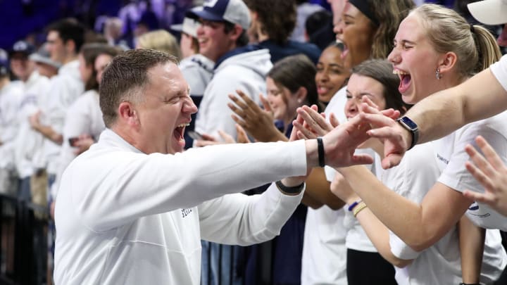 Penn State men's basketball coach Mike Rhoades celebrates a Nittany Lions victory with fans at the Bryce Jordan Center. Penn State men's basketball coach Mike Rhoades celebrates a Nittany Lions victory with fans at the Bryce Jordan Center.