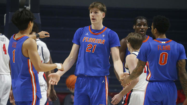 Feb 21, 2026; Oxford, Mississippi, USA; Florida Gators forward/center Alex Condon (21) reacts with guard Xaivian Lee (1) and guard Boogie Fland (0) during the first half against the Mississippi Rebels at The Sandy and John Black Pavilion at Ole Miss. Mandatory Credit: Petre Thomas-Imagn Images Feb 21, 2026; Oxford, Mississippi, USA; Florida Gators forward/center Alex Condon (21) reacts with guard Xaivian Lee (1) and guard Boogie Fland (0) during the first half against the Mississippi Rebels at The Sandy and John Black Pavilion at Ole Miss. Mandatory Credit: Petre Thomas-Imagn Images