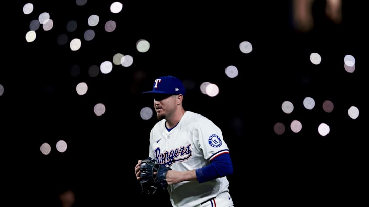 Apr 5, 2025; Arlington, Texas, USA; Texas Rangers relief pitcher Luke Jackson (77) gets ready to pitch during the ninth inning against the Tampa Bay Rays at Globe Life Field. Mandatory Credit: Kevin Jairaj-Imagn Images