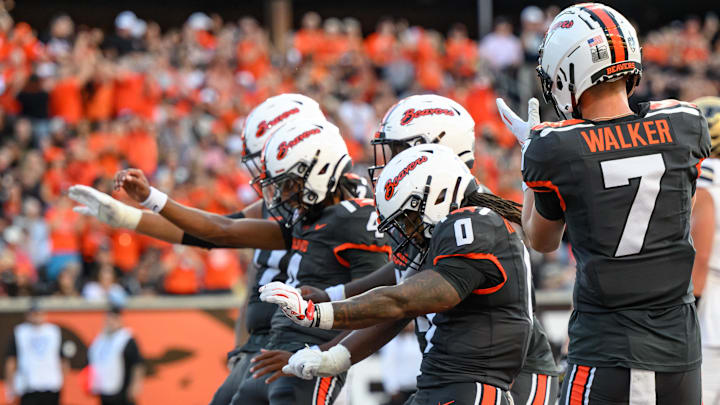 zSep 21, 2024; Corvallis, Oregon, USA; Oregon State Beavers running back Anthony Hankerson (0), wide receiver Trent Walker (7) and quarterback Gevani McCoy (4) celebrate a touchdown during the first quarter against the Purdue Boilermakers at Reser Stadium. Mandatory Credit: Craig Strobeck-Imagn Images zSep 21, 2024; Corvallis, Oregon, USA; Oregon State Beavers running back Anthony Hankerson (0), wide receiver Trent Walker (7) and quarterback Gevani McCoy (4) celebrate a touchdown during the first quarter against the Purdue Boilermakers at Reser Stadium. Mandatory Credit: Craig Strobeck-Imagn Images